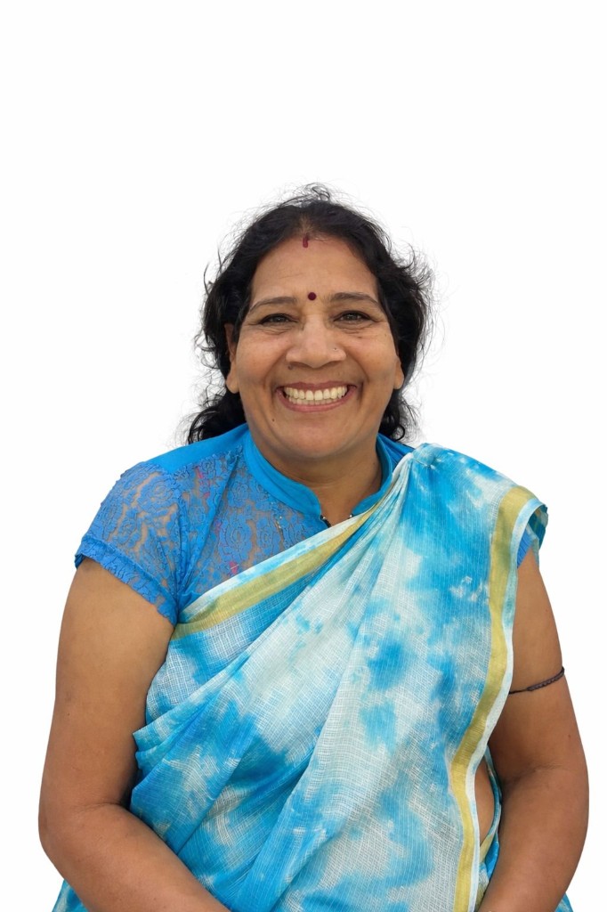 Happy Dentaura patient in blue saree after upper arch fixed implant rehabilitation