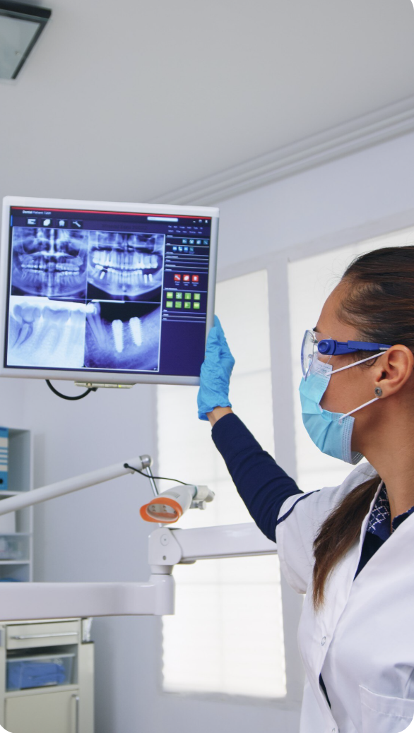 Dental professional using advanced digital X-ray technology at Dentaura